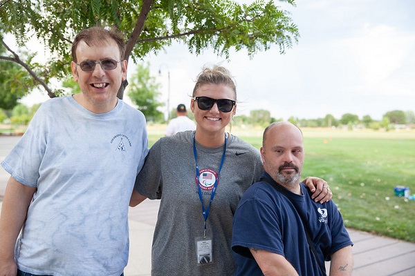 group of three people outdoor at a picnic
