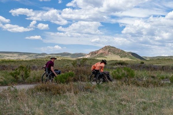 Two people use wheelchairs on a Fort Collins natural area trail