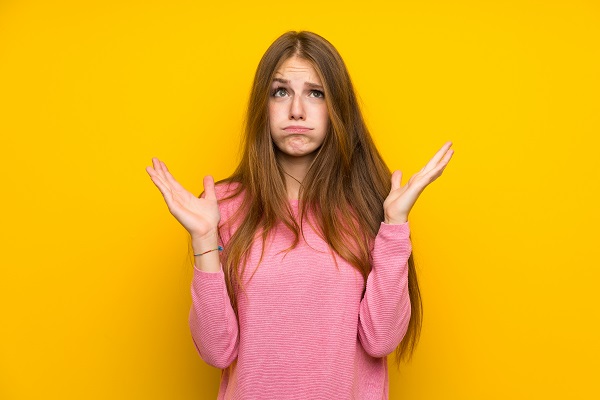 person holding hands up in frustration