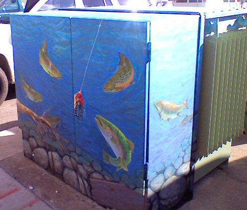 Transformer cabinet with a mural of fish and lure