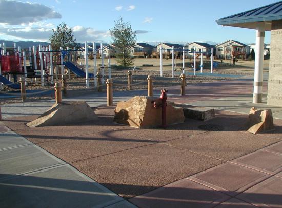 Stone sculpture seating area by playground