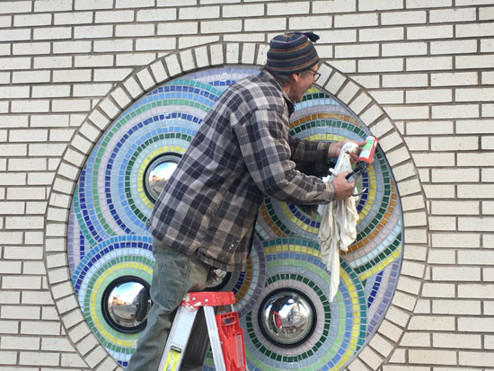 Artist installing work