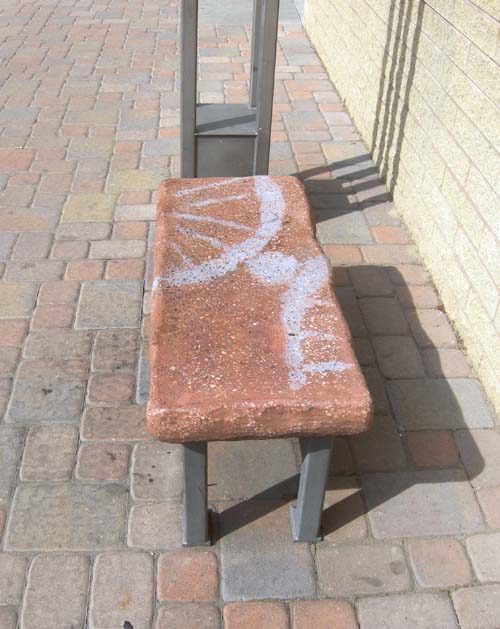 An example of a cast concrete bench at a Max station.