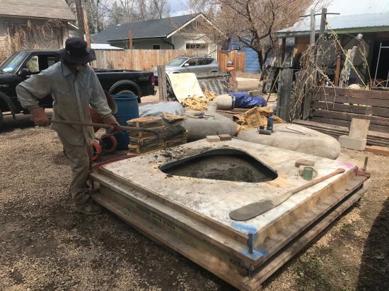 Artist Joe McGrane creating cement benches