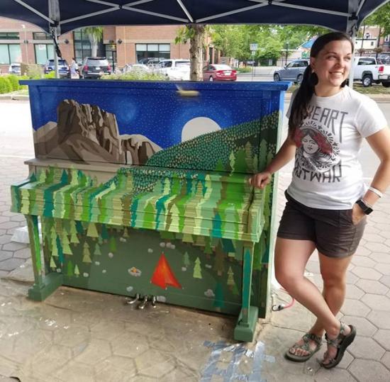 Carly Knowles and her piano mural