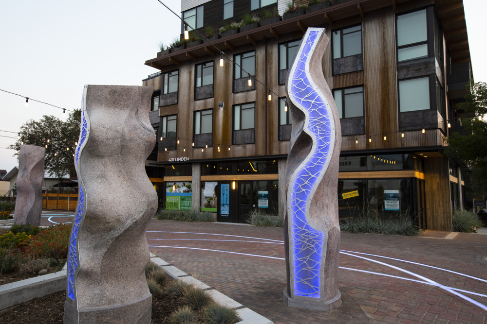 Sculptures lit at night.