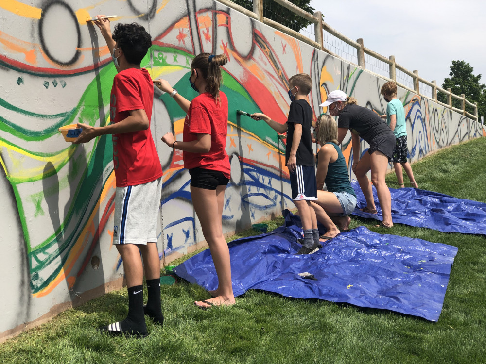 Community members painting on August 28