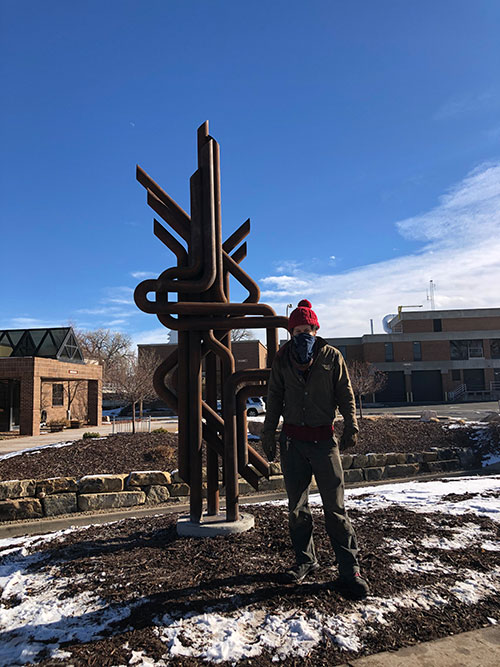 Todd Kundla with installed sculpture.