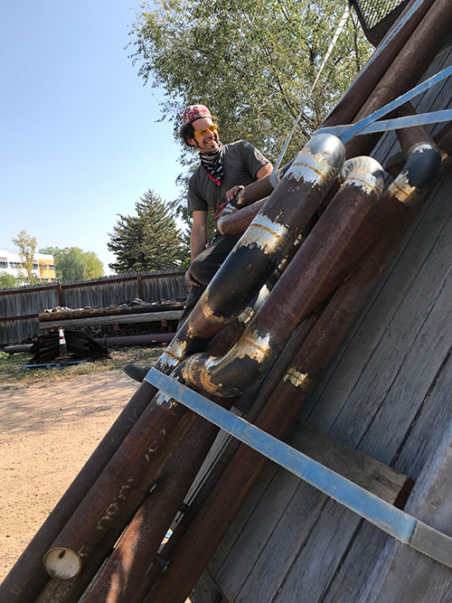 Artist Todd Kundla and sculpture in progress