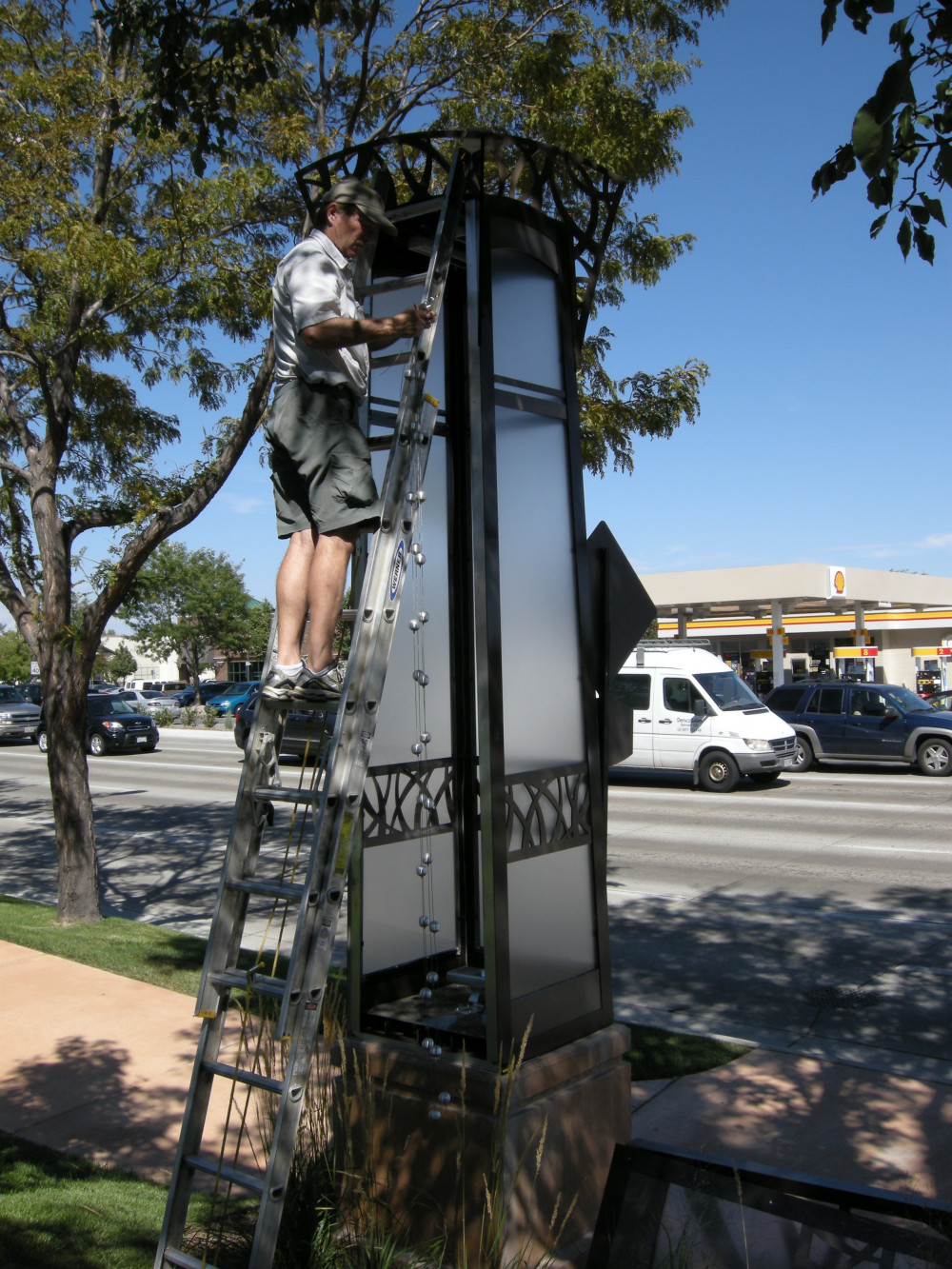 Tully hanging metal components from the inside of a column.