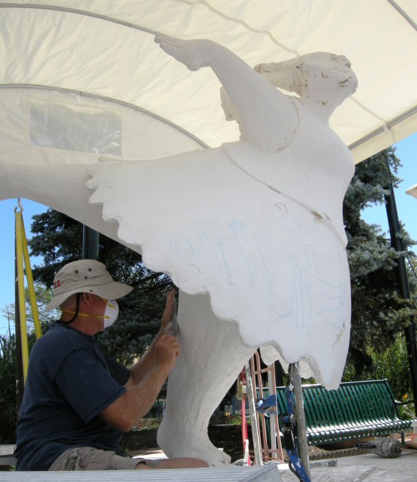 James Lynxwiler working on the clay sculpture.