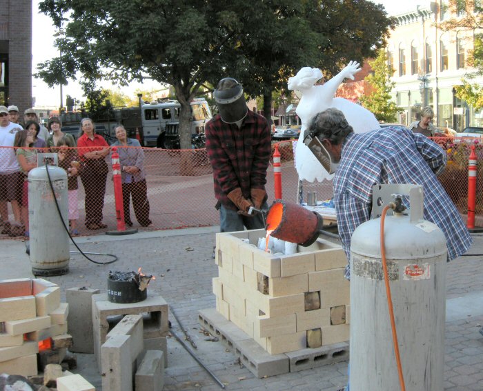 Live bronze pour demonstration on Old Town Square.