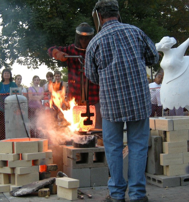 Live bronze pour demonstration on Old Town Square.