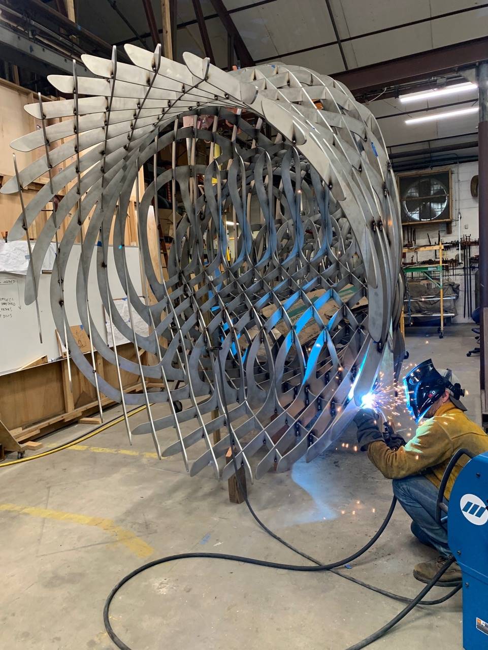 The sculpture being welded in the studio.