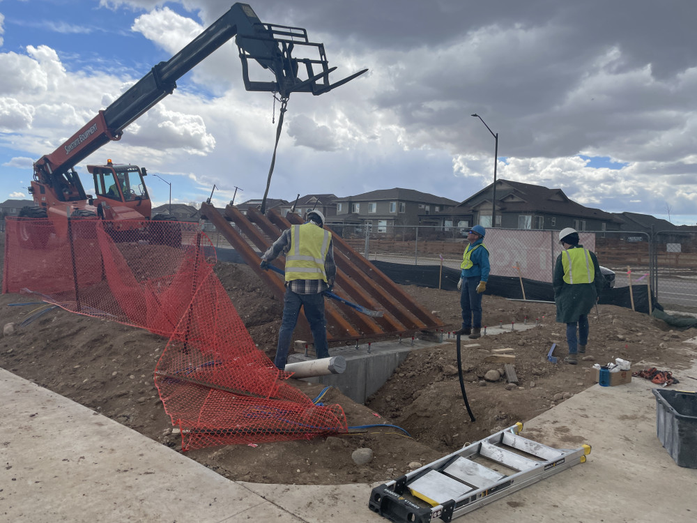 Josh and his team install the sculptures.