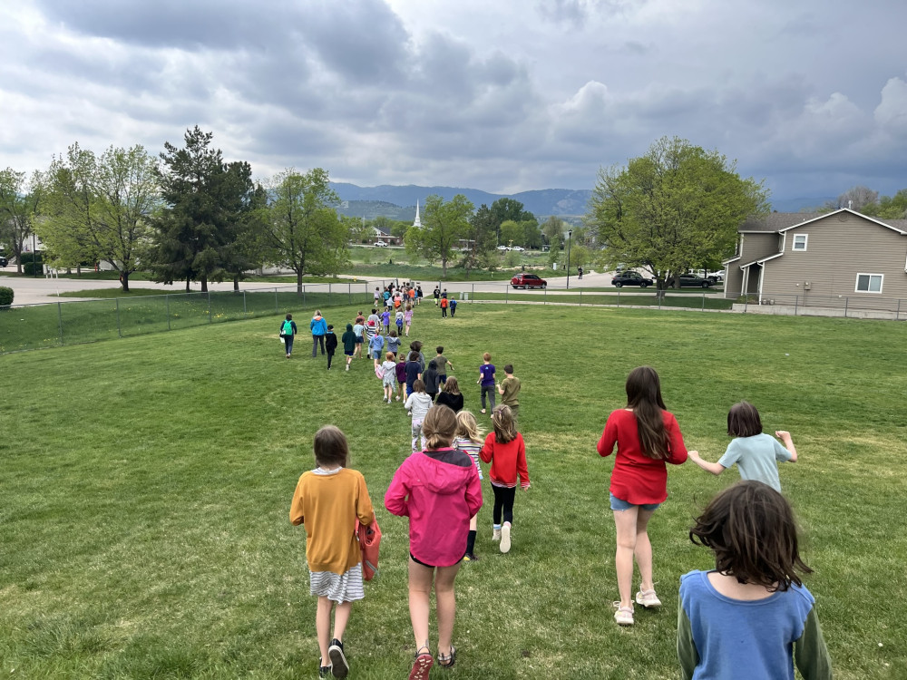 Polaris student walk to sculpture dedication.