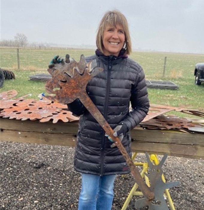 Lisa holding one of the sculptural elements