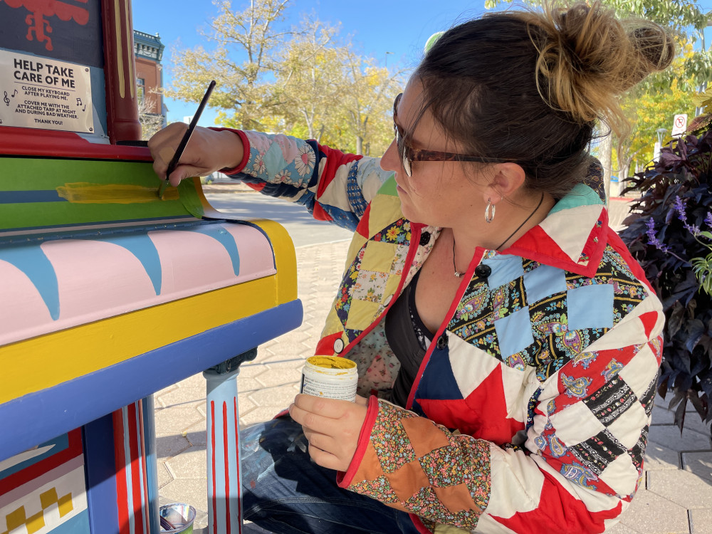 Chelsea painting her mural