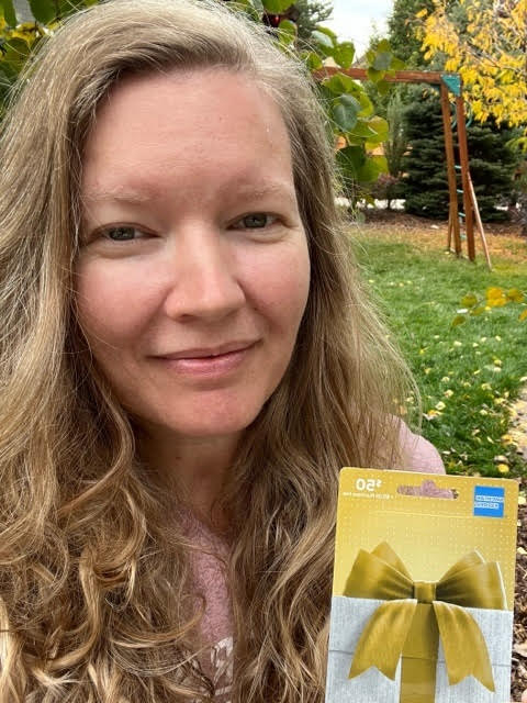 Photo of Margo with her gift card.