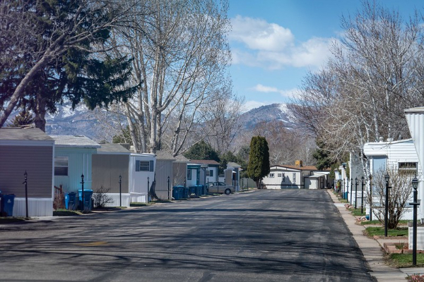 A neighborhood road with mountains in the background