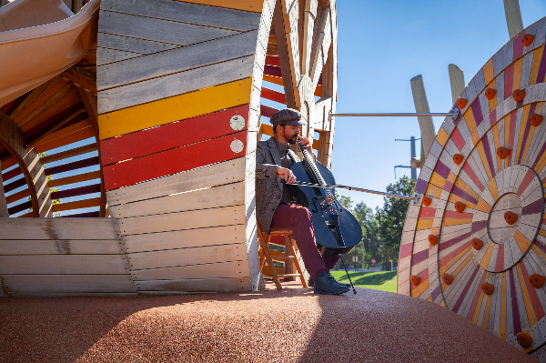 Russick Smith plays cello at Sugar Beet Park