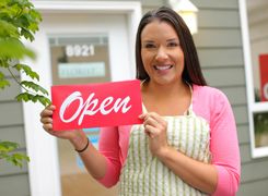 Photo of a person in an apron holding an
