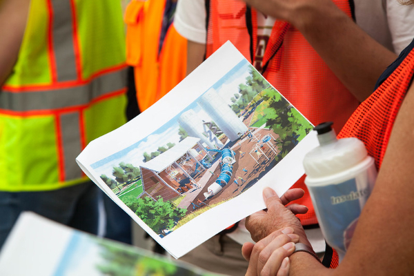 Photos showing a drawing of a future park