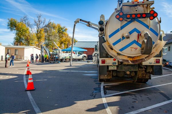A vac truck in a parking lot