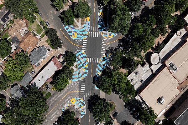 Aerial view of an asphalt art project by Jess Bean titled