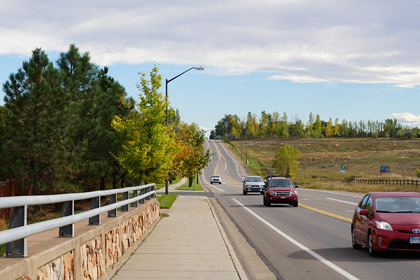 Cars traveling on the road.
