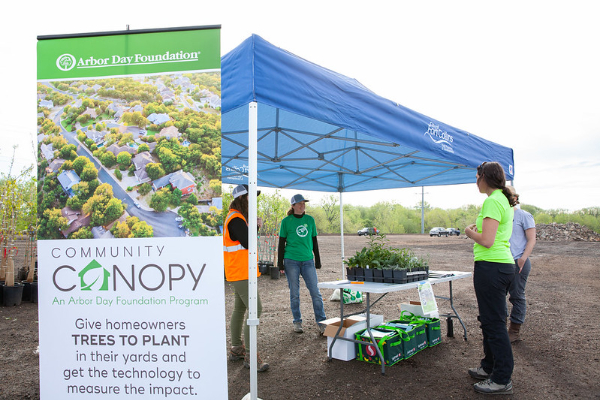 people chatting at previous community canopy event