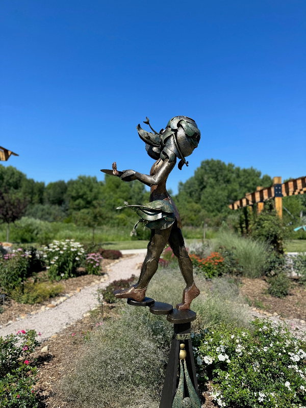 artist welding sculpture