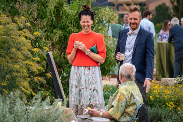 woman and man talking to an artist at Garden a'Fare