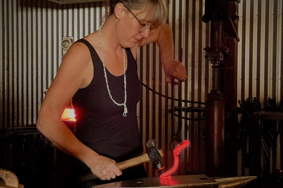 artist forging metal