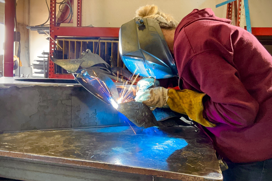 artist soldering metal