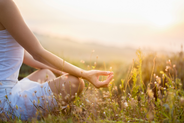 person meditating outside