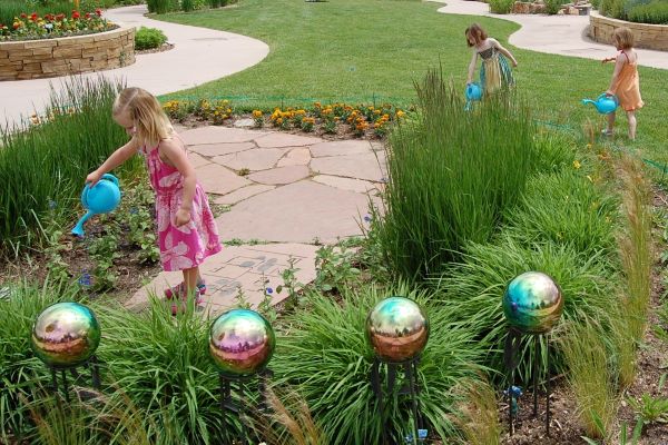 kids birthday party watering plants