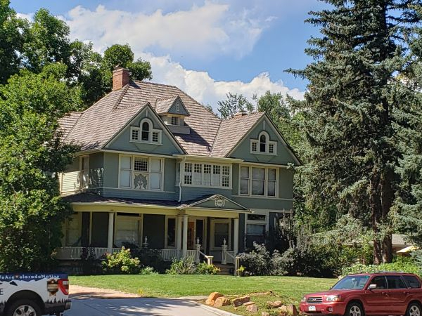 Roof with membrane shingle-style panels