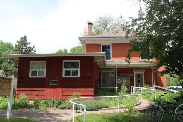 629 S. Howes, a two story brick house with a single story addition on the front