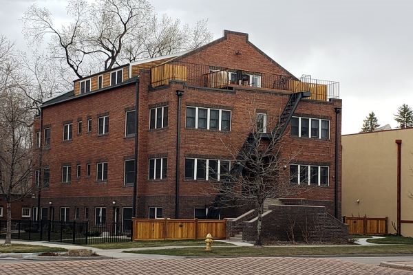 Three story brick apartment building