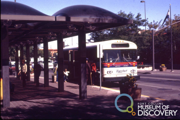 Transfort buses picking up passengers at Oak Street Plaza pavilion