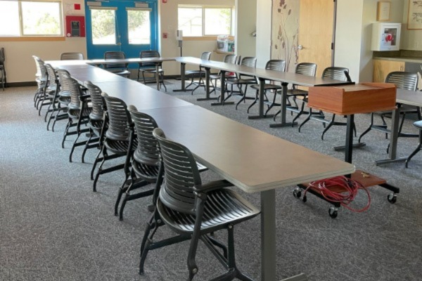 Tables in U Shape with chairs around them