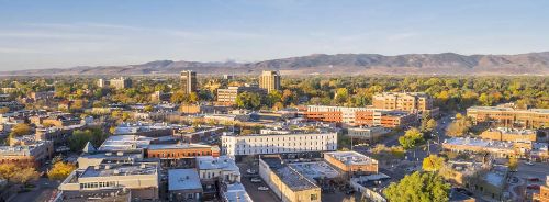 Aerial view of Fort Collins with foothills in the background.