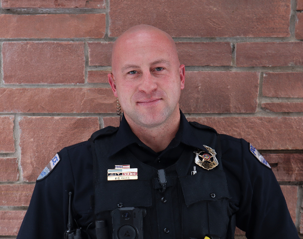 Male officer in uniform smiling