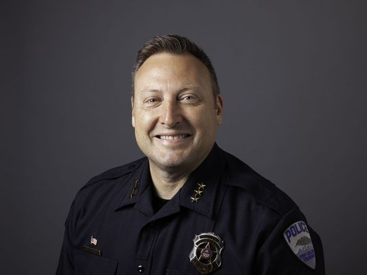 portrait of smiling police chief in uniform