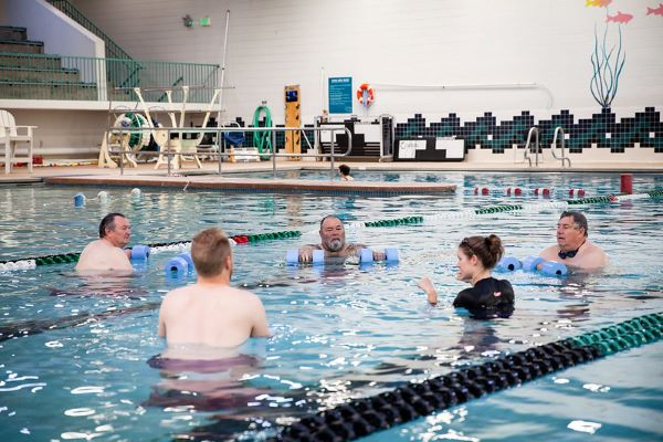 group of 5 doing water exercise