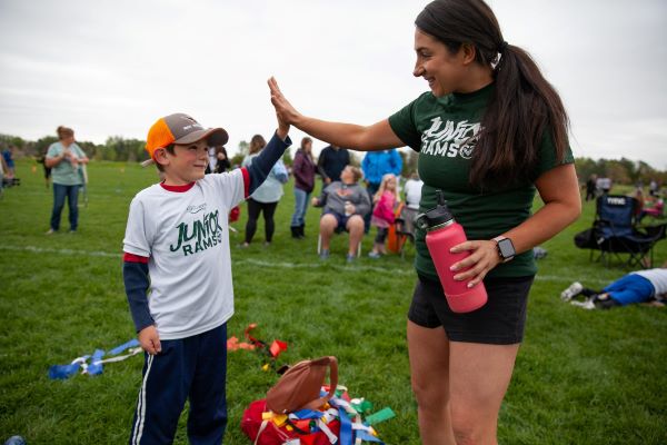 coach giving child a high five
