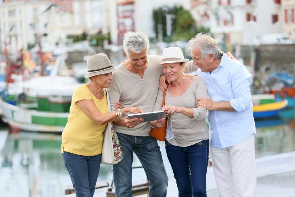 group of older people looking at map