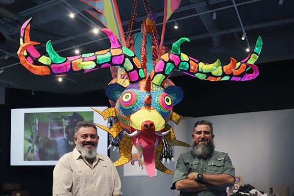 A photo of people at the Alebrije sculpture event.
