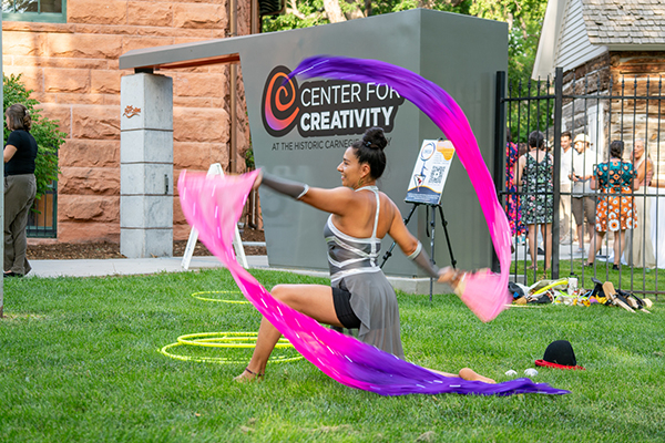A photo of a dancer performing a the Center for Creativity grand opening.
